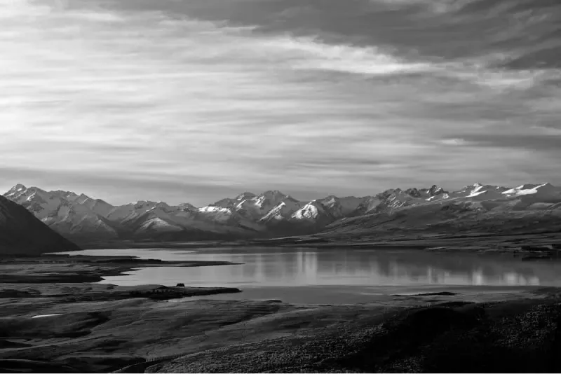 photography on a lake with moutains in the background